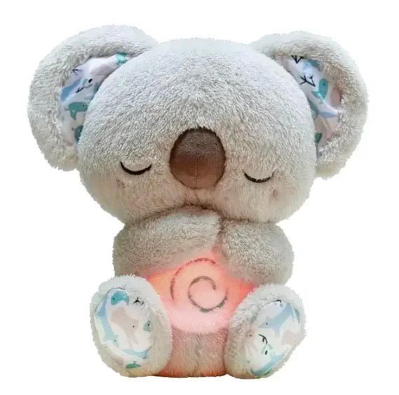 Plush toy koala with a glowing pink light on a white background